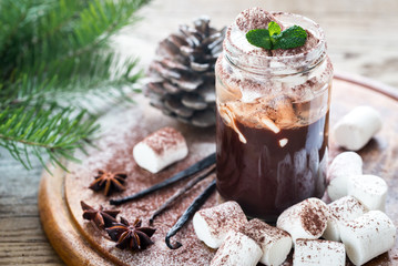 Obraz na płótnie Canvas Glass jar of hot chocolate with marshmallows