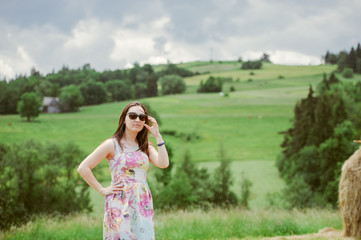 Obraz premium Brunette girl enjoying journey in mountains.