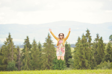 Brunette girl enjoying journey in mountains.