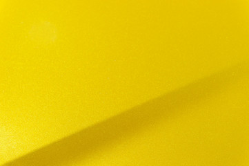 Fragment of yellow steel car bodywork, vehicle silver paint coating texture, selective focus, abstract - 131940889