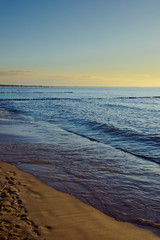 Breakwaters in the Baltic sea over the sunset