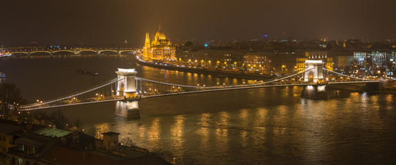 Panoramic night winter view of Chain Bridge and Parliament in Budapest, Hungary