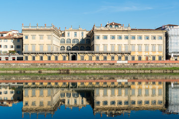 Fototapeta na wymiar View of Arno river embankment with architecture and buildings re