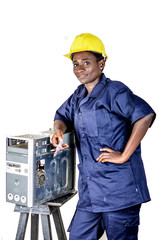 Young woman in uniform standing, elbow on a desktop computer.