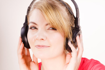 Fototapeta premium Woman in big headphones listening music
