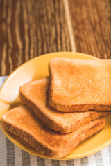 Fried toasts on yellow plate