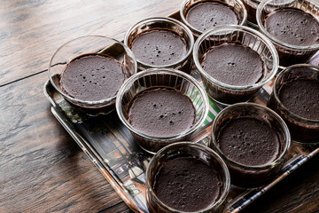 Homemade Chocolate Puddings in glass cups.