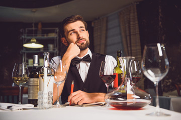 Man sitting and absorbedly thinking