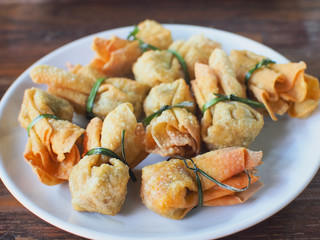 Selective focus/ Fried dumplings on a wooden table. Chinese food