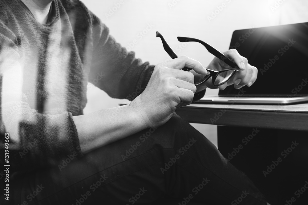 Aufkleber website designer holding eyeglass working computer laptop on woo
