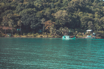 Boat at island as mint color vintage