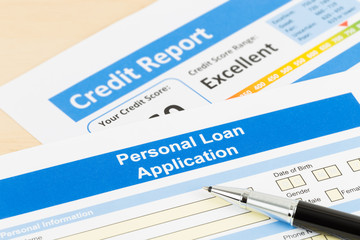 Personal loan application form excellent credit score with pen