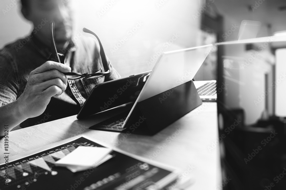 Poster website designer working digital tablet and computer laptop with