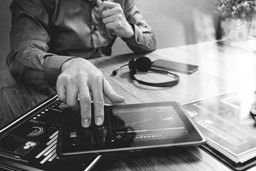 Businessman hand using VOIP headset with digital tablet computer