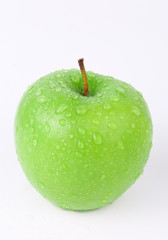 Juicy green apple isolated on white in studio - XXL file with selective focus.
