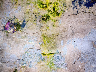 colorful wall with cracks and flaws