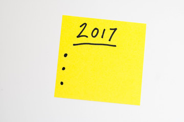yellow note with a to do list for the new year