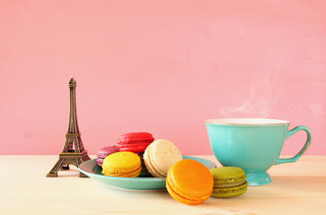 Cup of coffee and colorful macaron
