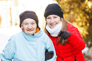 Elderly woman and young carer