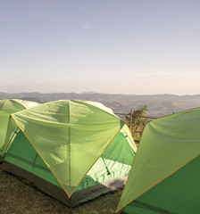 Camping tent with nature mountain outdoor background.
