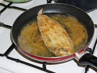 detail of a flounder fry in the oil