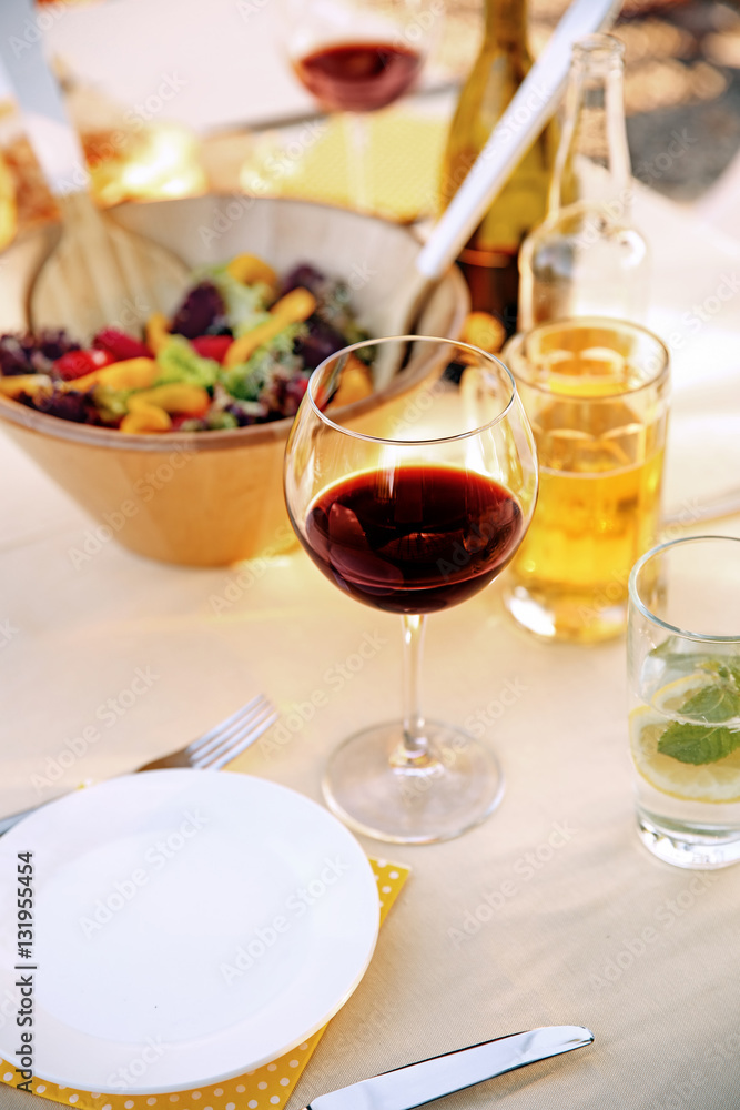 Poster table with food and drinks served for picnic, close up view