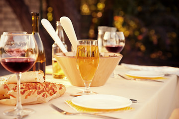 Table with food and drinks served for picnic