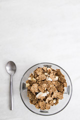 bowl of cereal integral with the spoon on background white