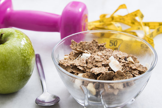 cereals, fruit and weights, concept of diet and living healthy