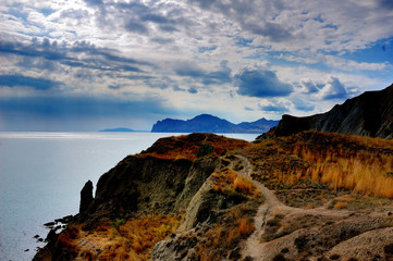 Tikhaya Cove of the Bay of Koktebel, Crimea /Tihaya (Quiet) Bay is known that this rare storm. In the distance is a mountain massif Kara-Dag. Near Koktebel. Eastern Crimea