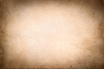 Old, brown  paper texture with vignette. Dotted.