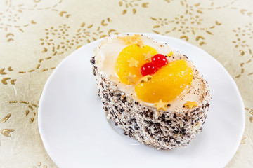 mini cake with cream and berries