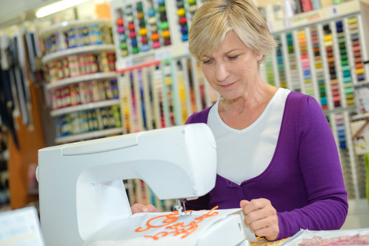 woman on sewing machine