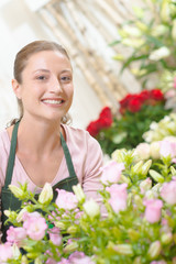 Portrait of attractive smiling female florist