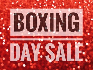 Boxing Day sale words on shiny red glitter background