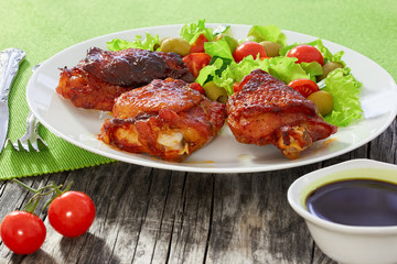 grilled chicken thighs with green fresh salad