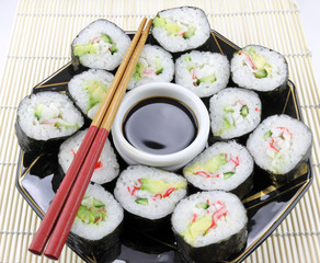 Plate of sushi with chop sticks