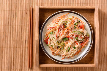 Asian salad with rice noodles and vegetables.