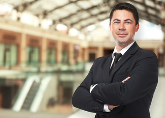 Man on shopping mall background. Wholesale and logistics concept