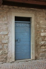 Fototapeta na wymiar Blue wooden door. Rango, Trentino, Italy