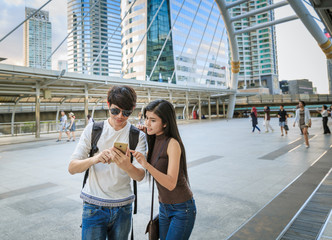 Asian Couple Sightseeing In City Trip
