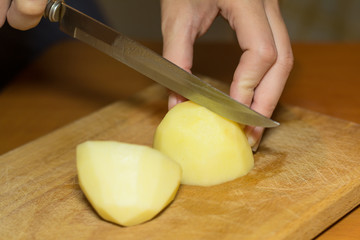 Obraz na płótnie Canvas Cutting Potato