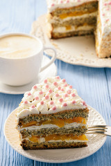 Homemade bisсuit cake with whipped cream and peaches.