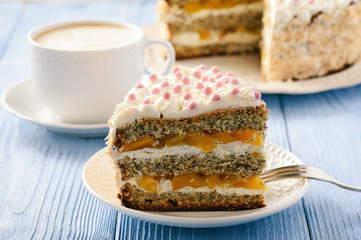 Homemade bisсuit cake with whipped cream and peaches.