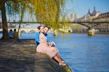 Romantic couple on the Seine embankment in Paris
