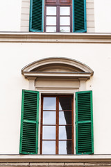 window with blinds in urban house in Florence