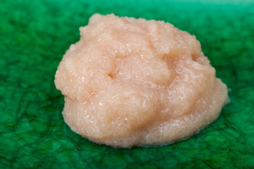 salty caviar of codfish close up on green plate