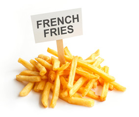 Pile of potato fries on kraft paper. Poor street food, obesity, heart disease. French fries with a sign, Empty copy space for text