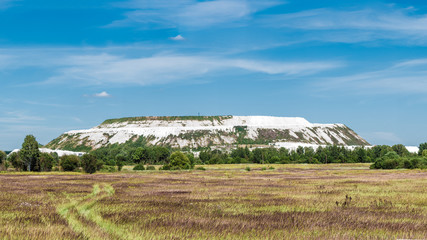 Panorama of artificial mountains of waste limestone