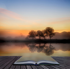 Stunning vibrant Autumn foggy sunrise English countryside landsc